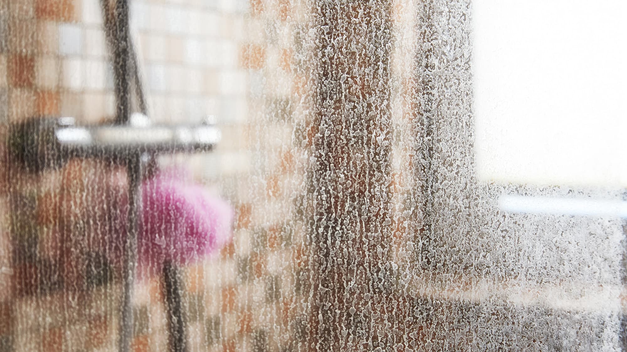 Shower screen with limescale – ActivFlo helps keep showers clean